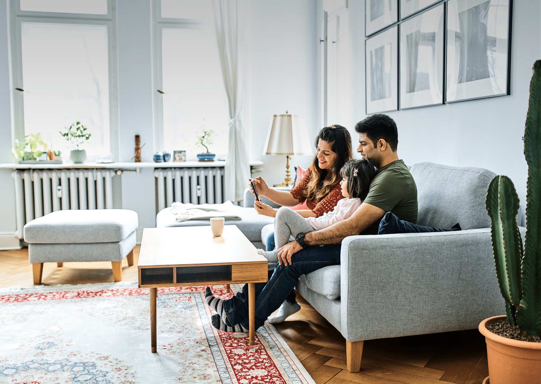 Family sits happily in the living room as external blinds protect them from the heat